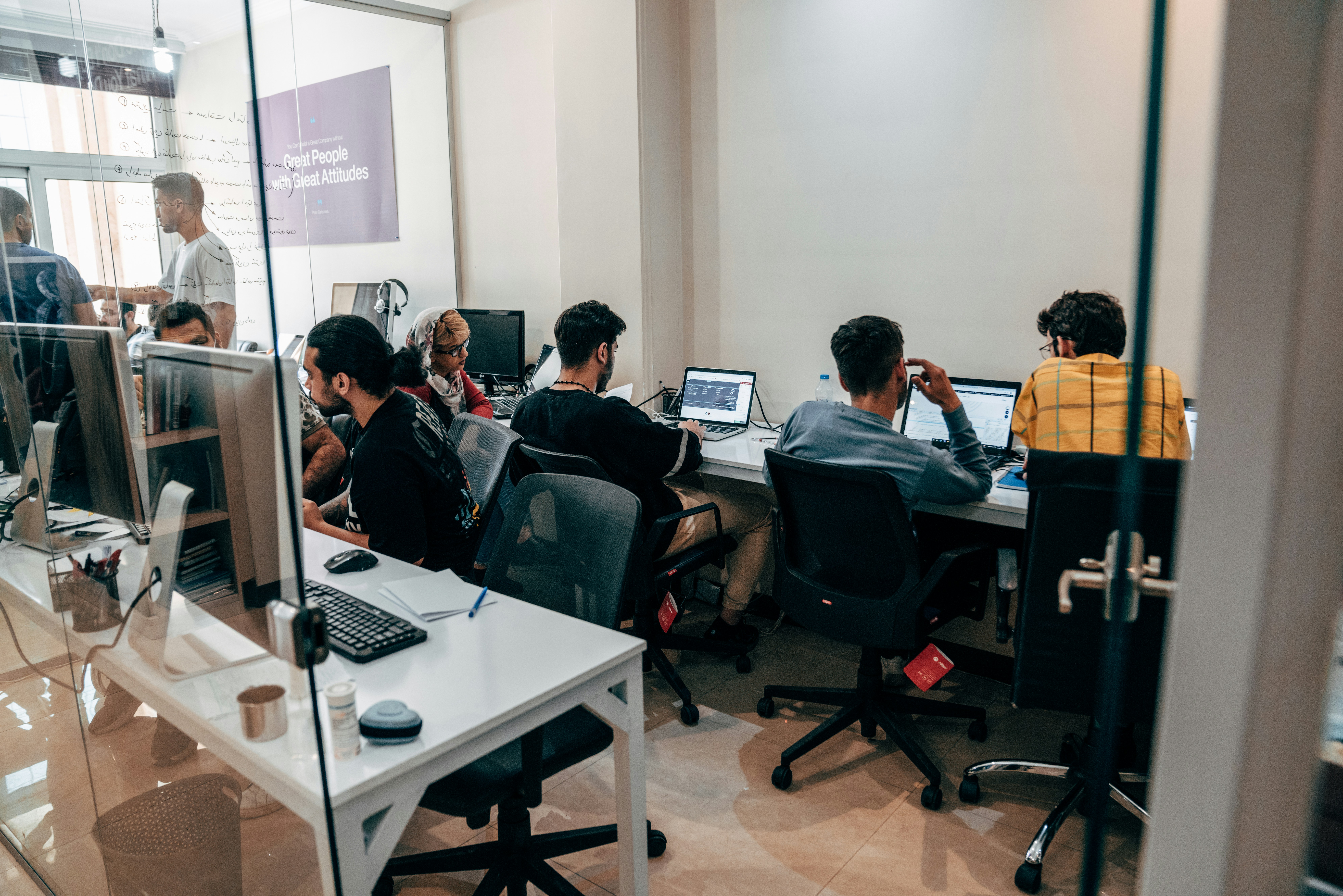 Small team discussing a project scope around a table